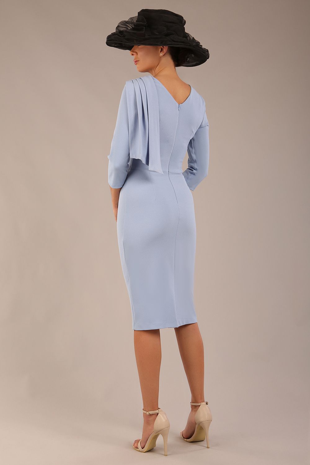 brunette model is wearing a diva catwalk Frieth Gathered Shoulder Dress 3/4 sleeves knee length with shoulder detail in powder blue colour back image