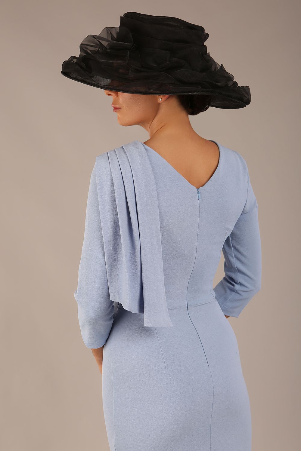 brunette model is wearing a diva catwalk Frieth Gathered Shoulder Dress 3/4 sleeves knee length with shoulder detail in powder blue colour back image