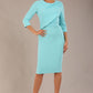 brunette model is wearing a diva catwalk Frieth Gathered Shoulder Dress 3/4 sleeves knee length with shoulder detail in turquoise colour front image