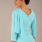 brunette model is wearing a diva catwalk Frieth Gathered Shoulder Dress 3/4 sleeves knee length with shoulder detail in turquoise colour back image