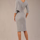brunette model is wearing a diva catwalk Frieth Gathered Shoulder Dress 3/4 sleeves knee length with shoulder detail in dove grey colour back image