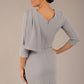 brunette model is wearing a diva catwalk Frieth Gathered Shoulder Dress 3/4 sleeves knee length with shoulder detail in dove grey colour back image