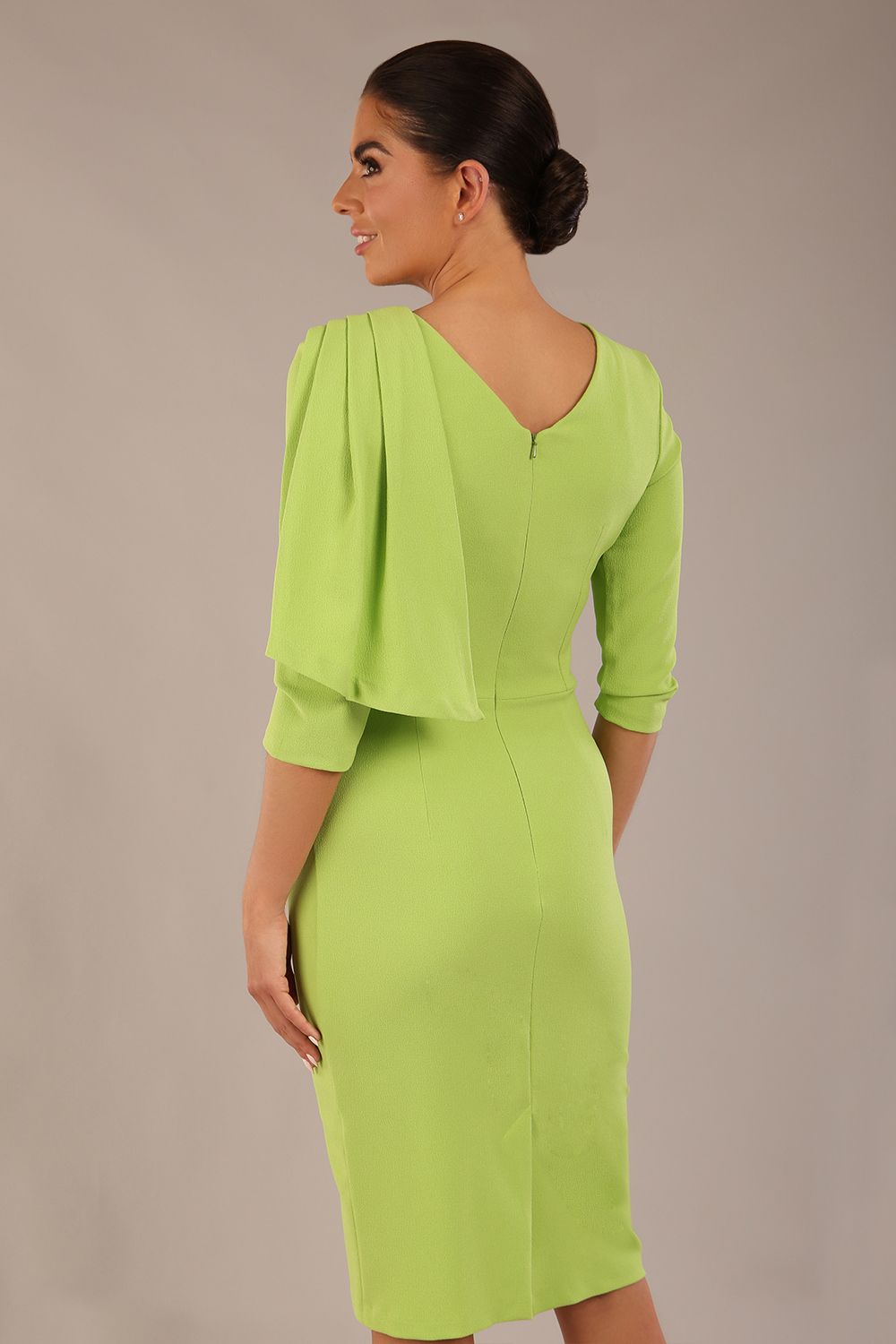 brunette model is wearing a diva catwalk Frieth Gathered Shoulder Dress 3/4 sleeves knee length with shoulder detail in paradise green colour back image