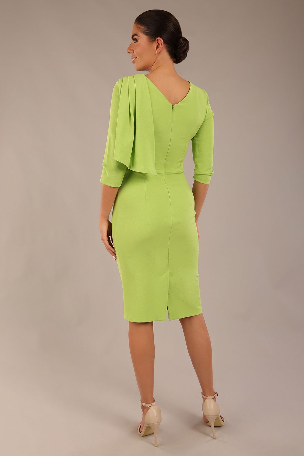 brunette model is wearing a diva catwalk Frieth Gathered Shoulder Dress 3/4 sleeves knee length with shoulder detail in paradise green colour back image