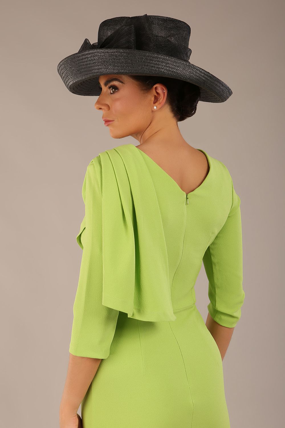 brunette model is wearing a diva catwalk Frieth Gathered Shoulder Dress 3/4 sleeves knee length with shoulder detail in paradise green colour back image close up