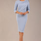 brunette model is wearing a diva catwalk Frieth Gathered Shoulder Dress 3/4 sleeves knee length with shoulder detail in powder blue colour front image