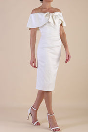 Model wearing diva catwalk Camilla dress in Ivory Cream side