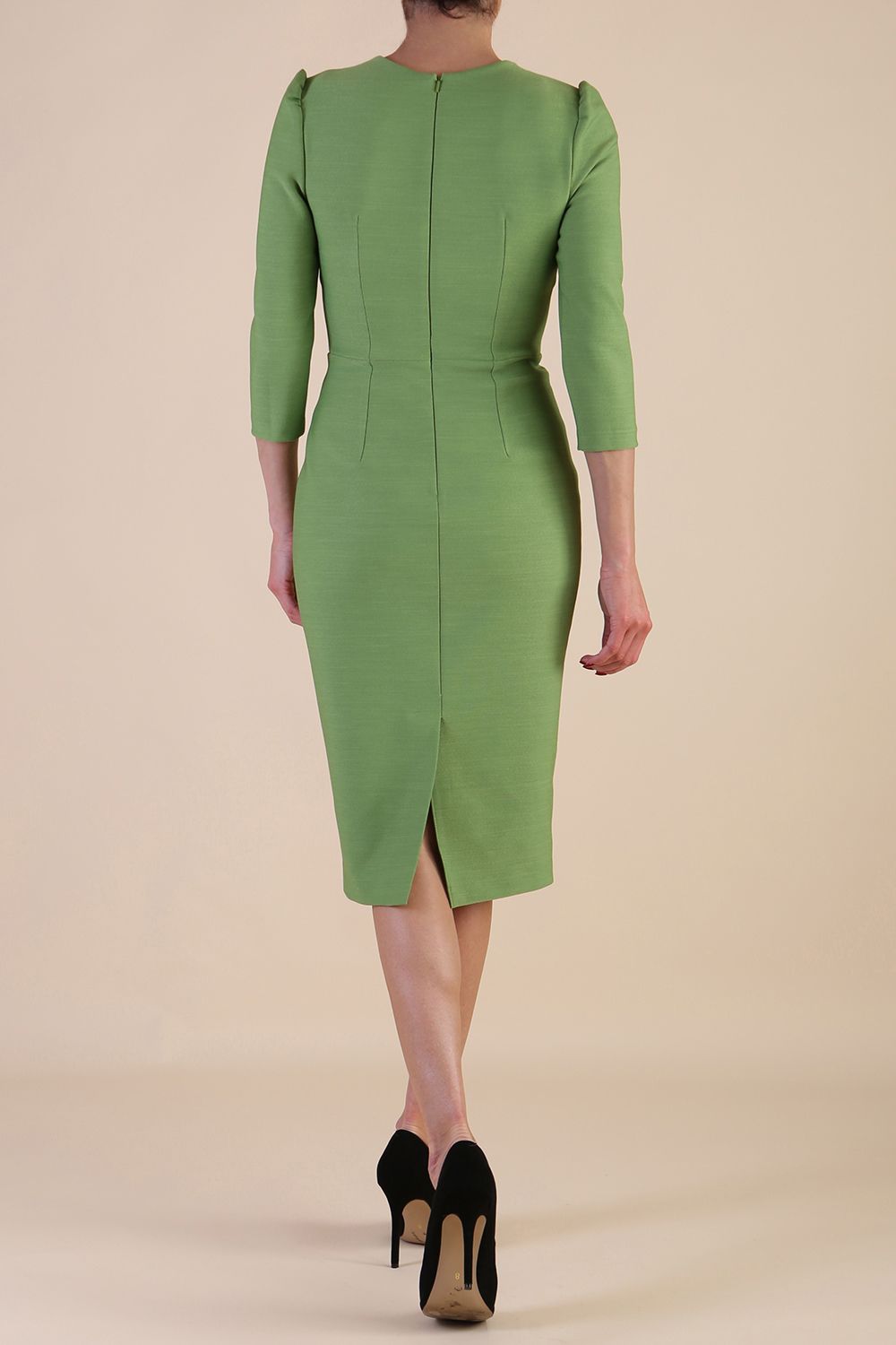 Model wearing diva catwalk Aurelia 3/4 Sleeve Knee Lenght Pencil Dress in Citus Green back