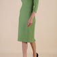 Model wearing diva catwalk Aurelia 3/4 Sleeve Knee Lenght Pencil Dress in Citus Green side