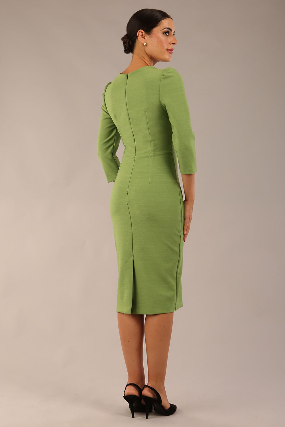 Model wearing diva catwalk Aurelia 3/4 Sleeve Knee Lenght Pencil Dress in Citus Green back