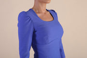 Model wearing diva catwalk Aurelia 3/4 Sleeve Knee Lenght Pencil Dress in Thistle Blue detail on the bust