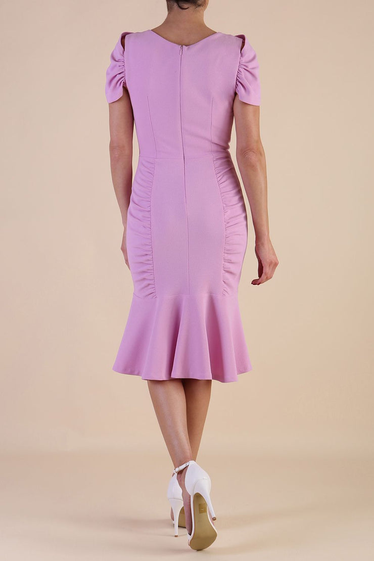 Model wearing diva catwalk Seraphina Fishtail skirt dress in Dawn Pink back