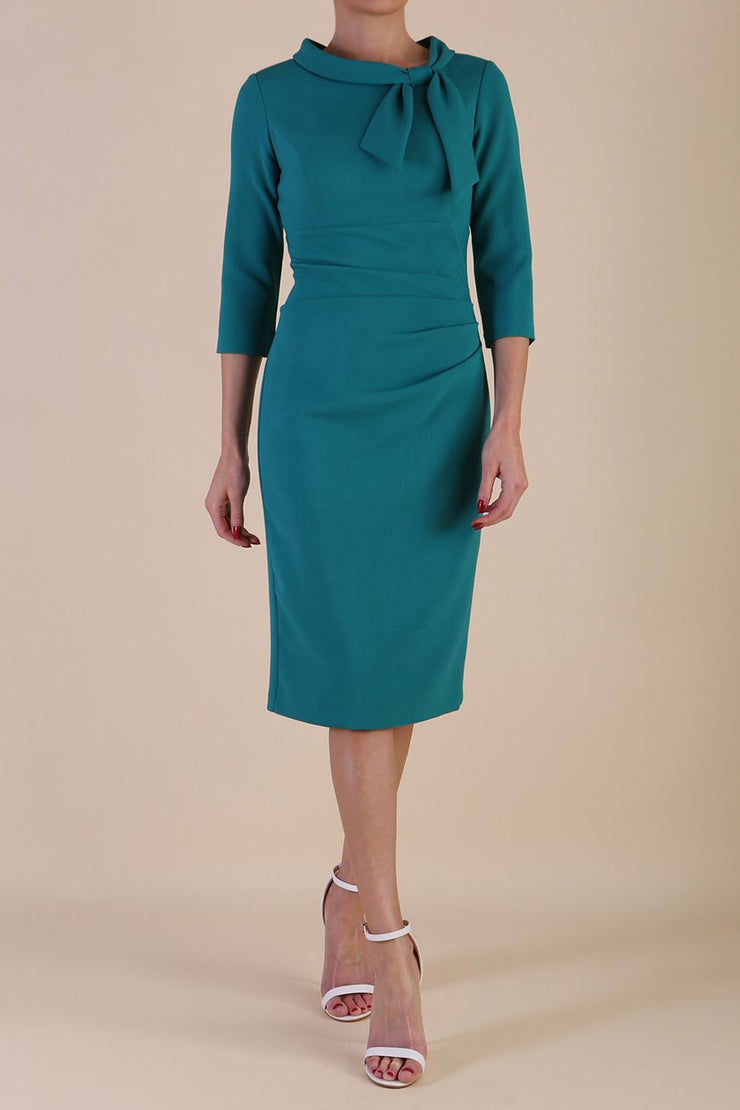 Model wearing diva catwalk Juliette 3/4 Sleeve Knee Length Pencil dress in Parasailing Green front