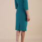 Model wearing diva catwalk Juliette 3/4 Sleeve Knee Length dress in Parasailing Green back
