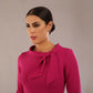 Model is wearing a diva catwalk Juliette 3/4 Sleeve Knee Length dress with bow detail in magenta close up