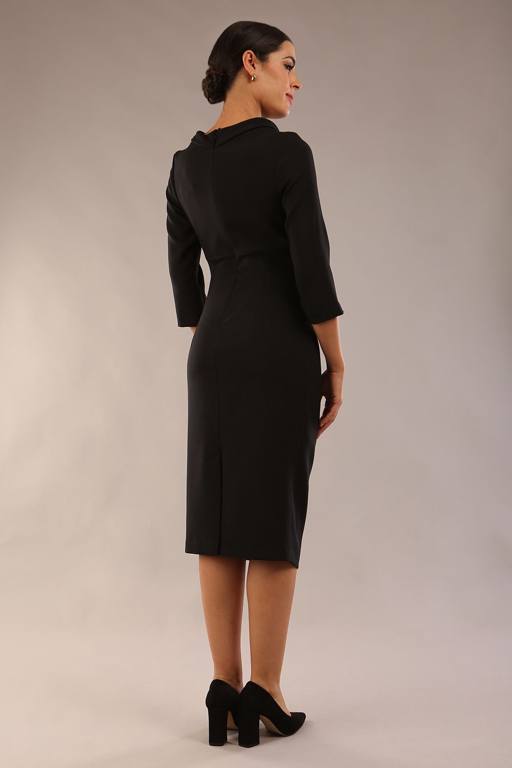 Model is wearing a diva catwalk Juliette 3/4 Sleeve Knee Length dress with bow detail  in Black back