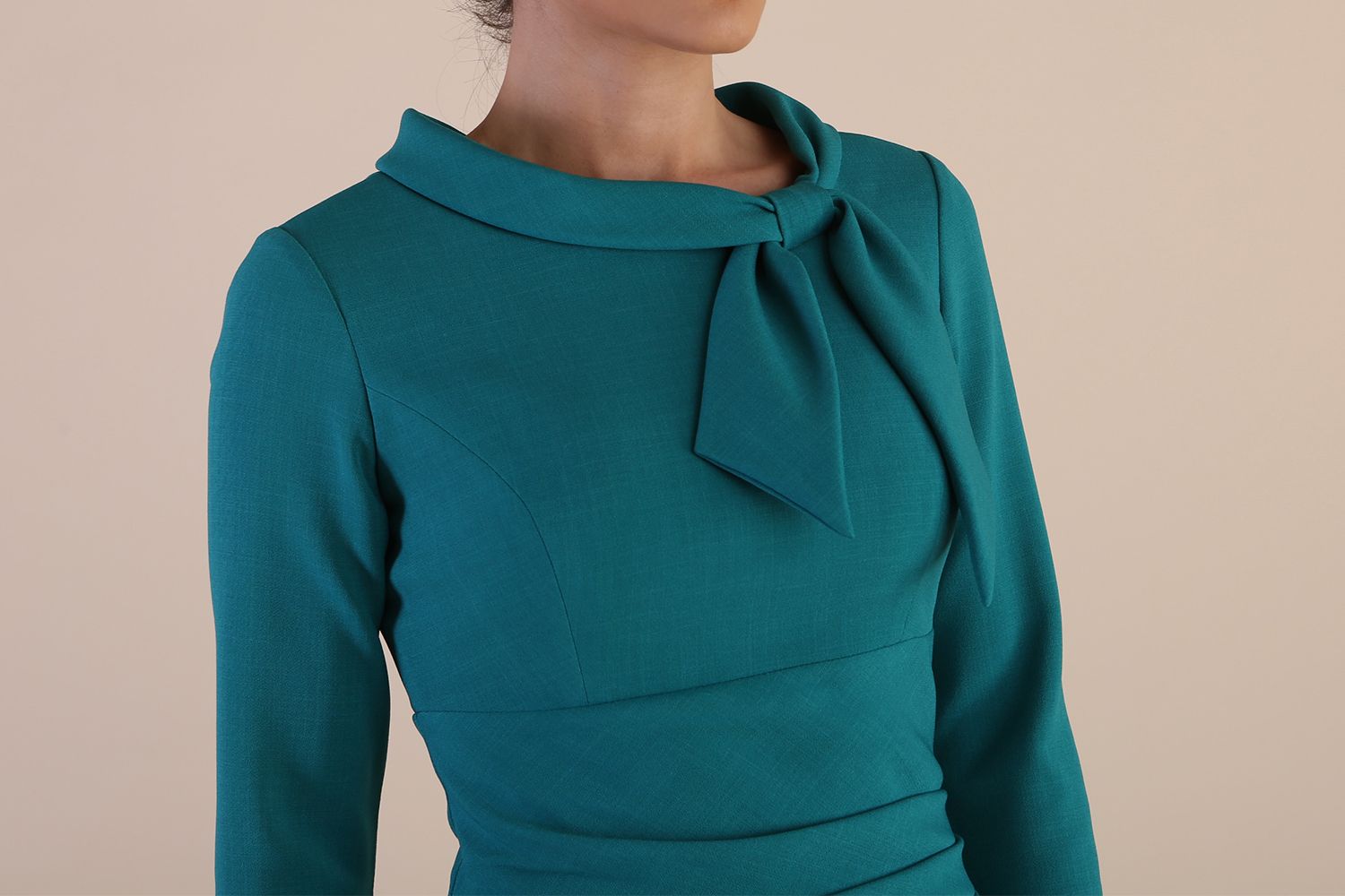 Detail Model wearing diva catwalk Juliette 3/4 Sleeve Knee Length Pencil dress Bow collar neckline in Parasailing Green side