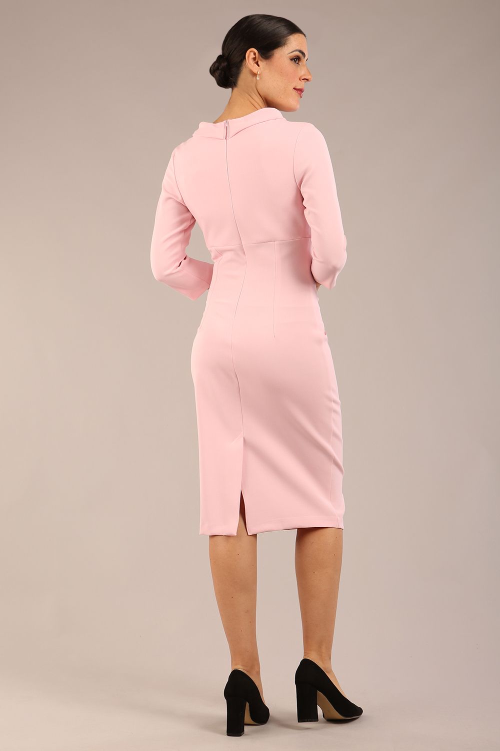 Model is wearing a diva catwalk Juliette 3/4 Sleeve Knee Length dress with bow detail in crystal pink colour back