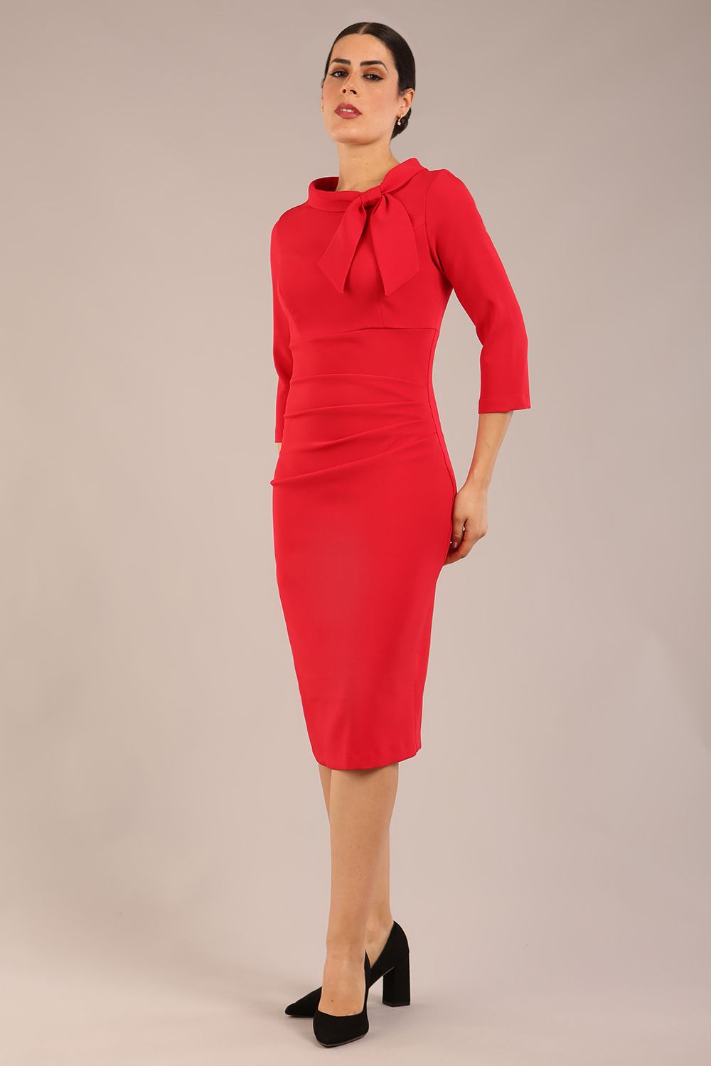 Model is wearing a diva catwalk Juliette 3/4 Sleeve Knee Length dress with bow detail in scarlet red colour