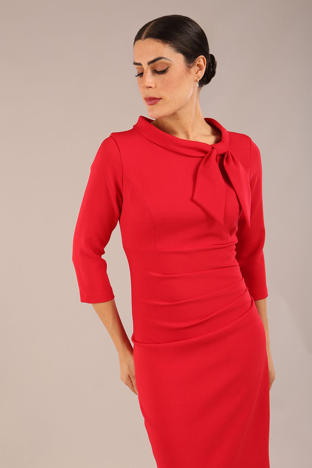 Model is wearing a diva catwalk Juliette 3/4 Sleeve Knee Length dress with bow detail in scarlet red colour