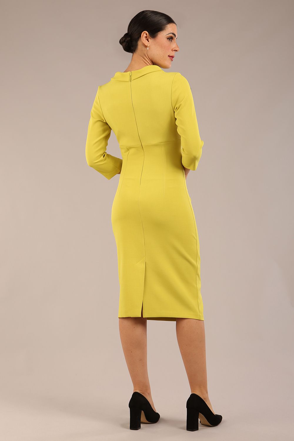 Model is wearing a diva catwalk Juliette 3/4 Sleeve Knee Length dress with bow detail in citrus green colour back