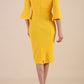 Model wearing diva catwalk Santorini 3/4 Length Bell Sleeve Midi Pencil Dress in Saffron Yellow back