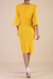 Model wearing diva catwalk Santorini 3/4 Length Bell Sleeve Midi Pencil Dress in Saffron Yellow back