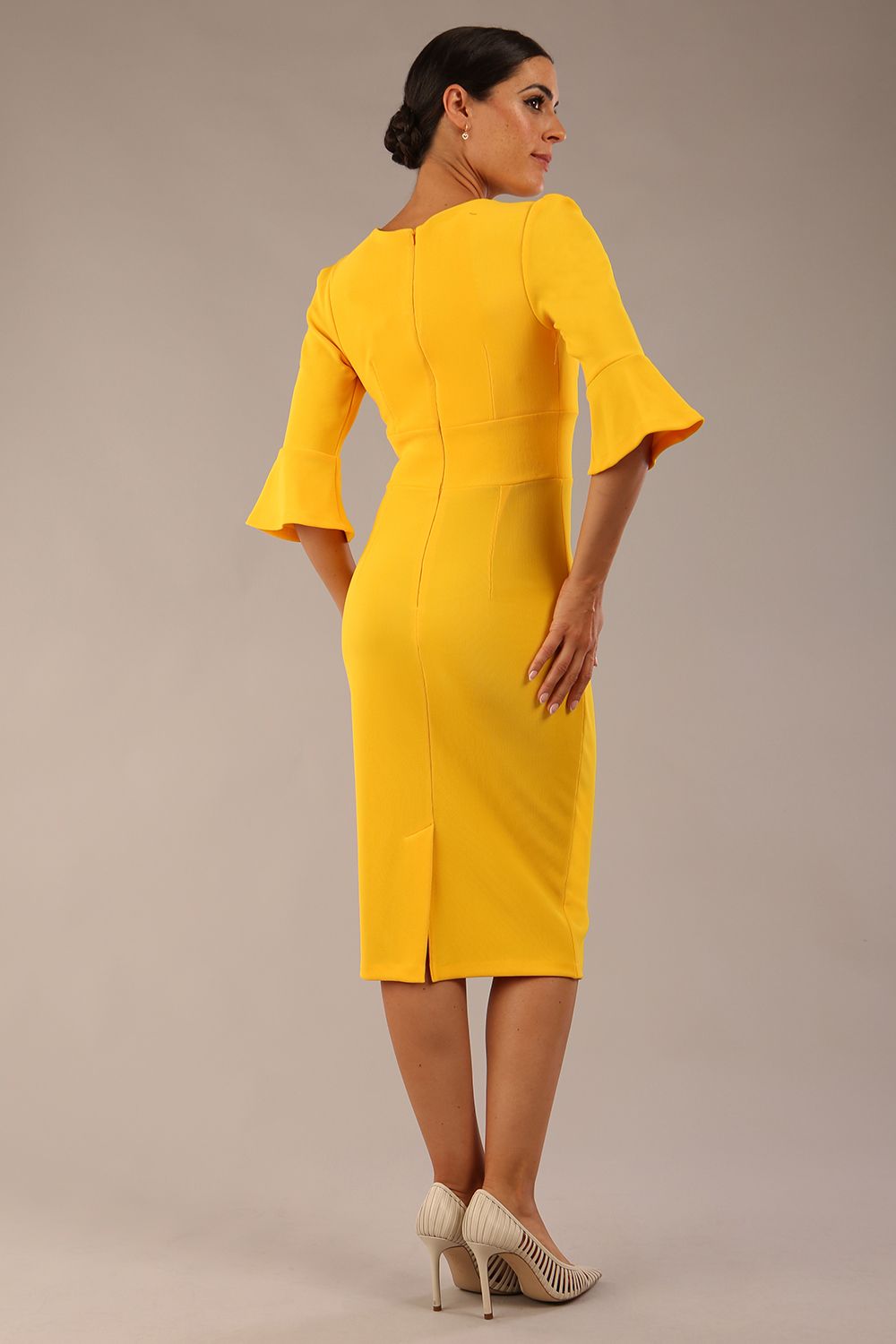 Model wearing diva catwalk Santorini 3/4 Length Bell Sleeve Midi Pencil Dress in Sunshine Yellow back