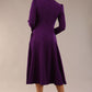 Model wearing diva catwalk Kate 3/4 Length Sleeve A-Line Swing Dress with pockets in Deep Purple back