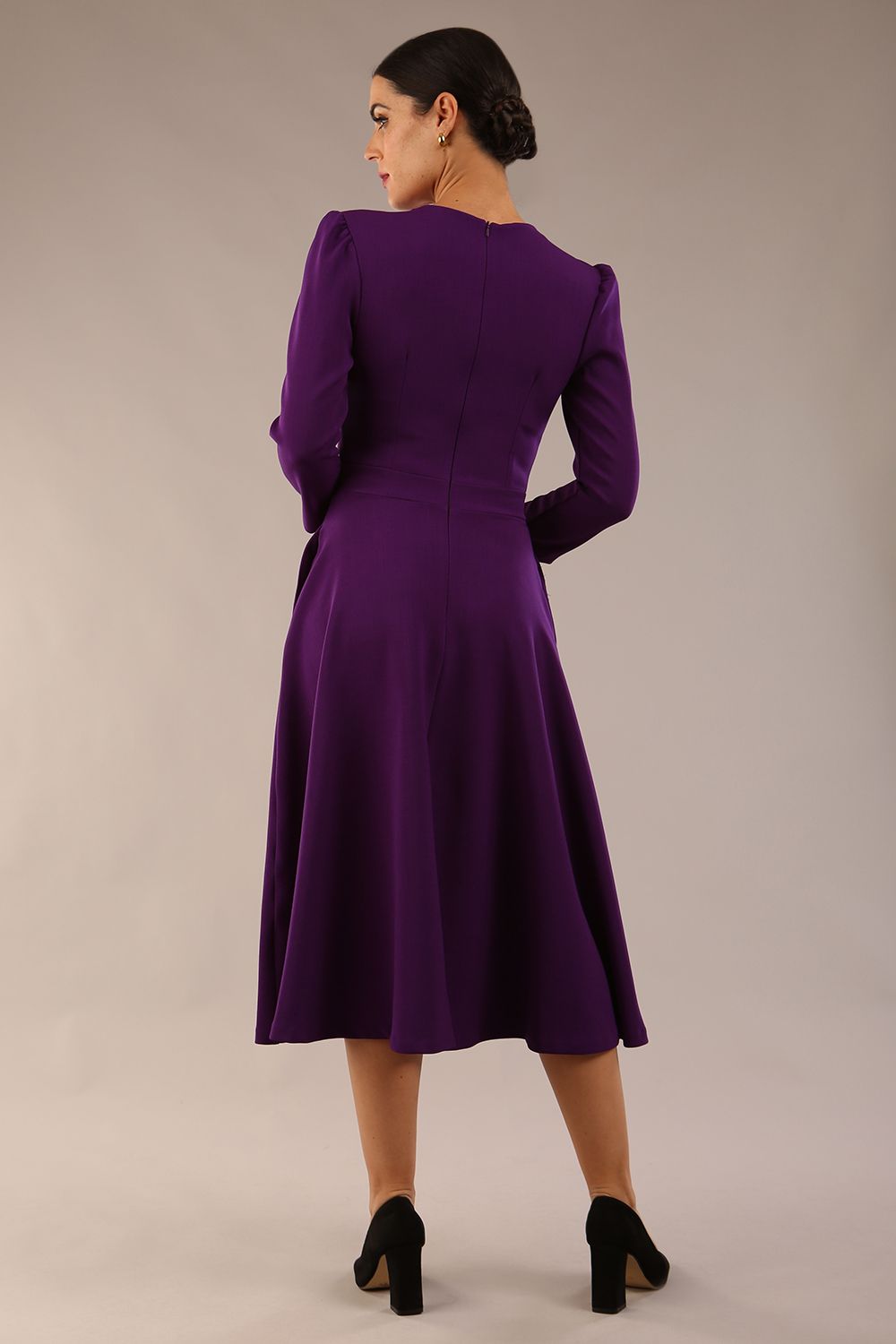 Model wearing diva catwalk Kate 3/4 Length Sleeve A-Line Swing Dress with pockets in Deep Purple back