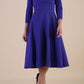 Model wearing diva catwalk Kate 3/4 Length Sleeve A-Line Swing Dress in Spectrum Indigo with pockets front
