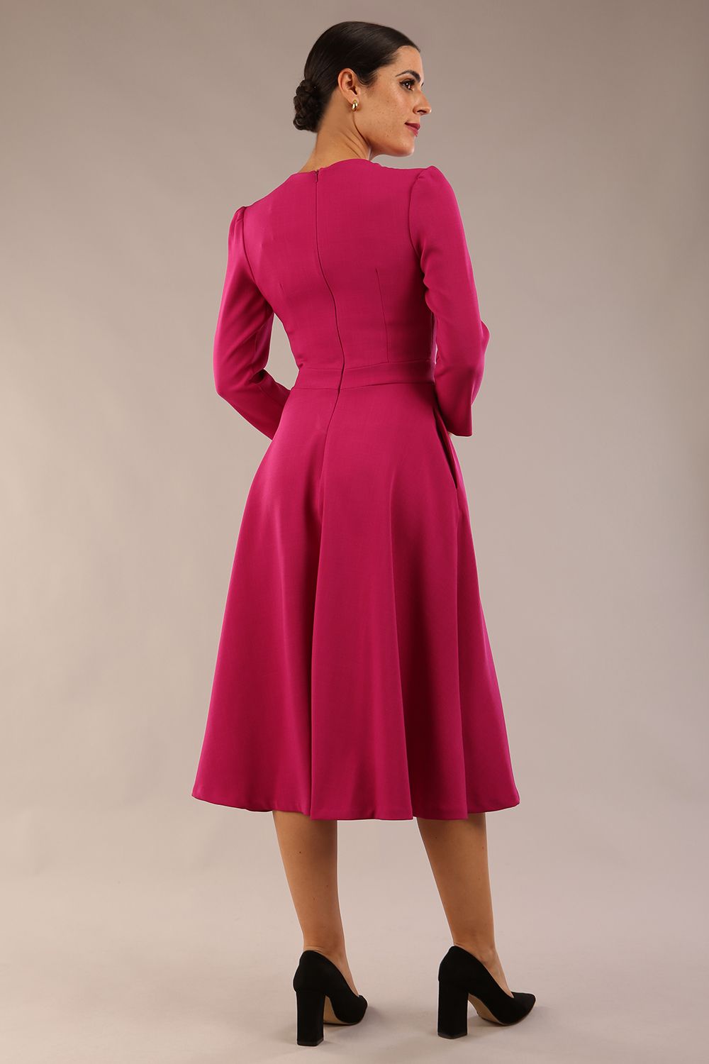 Model wearing diva catwalk Kate 3/4 Length Sleeve A-Line Swing Dress in Magenta Haze with pockets back