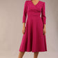 Model wearing diva catwalk Kate 3/4 Length Sleeve A-Line Swing Dress in Magenta Haze with pockets front