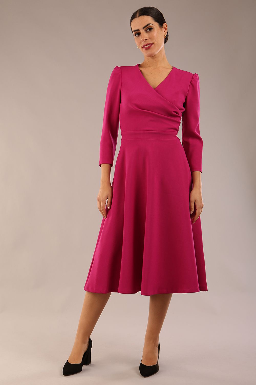 Model wearing diva catwalk Kate 3/4 Length Sleeve A-Line Swing Dress in Magenta Haze with pockets front