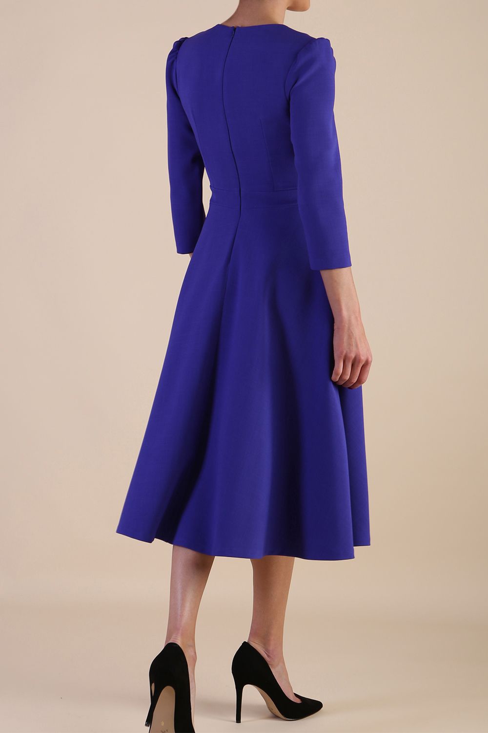 Model wearing diva catwalk Kate 3/4 Length Sleeve A-Line Swing Dress in Spectrum Indigo with pockets back