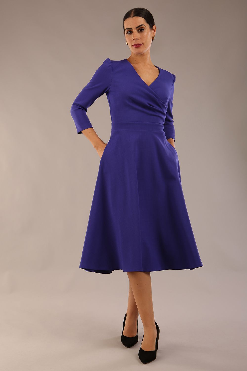 Model wearing diva catwalk Kate 3/4 Length Sleeve A-Line Swing Dress in Spectrum Indigo with pockets  side