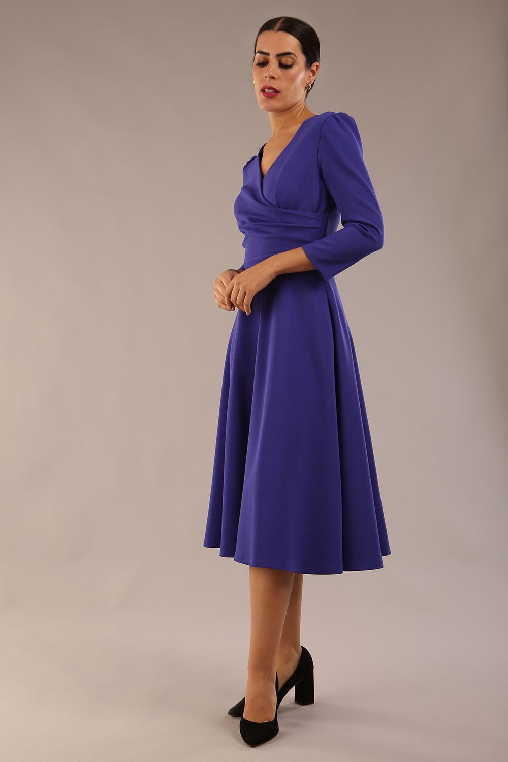 Model wearing diva catwalk Kate 3/4 Length Sleeve A-Line Swing Dress in Spectrum Indigo with pockets  side