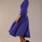 Model wearing diva catwalk Kate 3/4 Length Sleeve A-Line Swing Dress in Spectrum Indigo with pockets  side