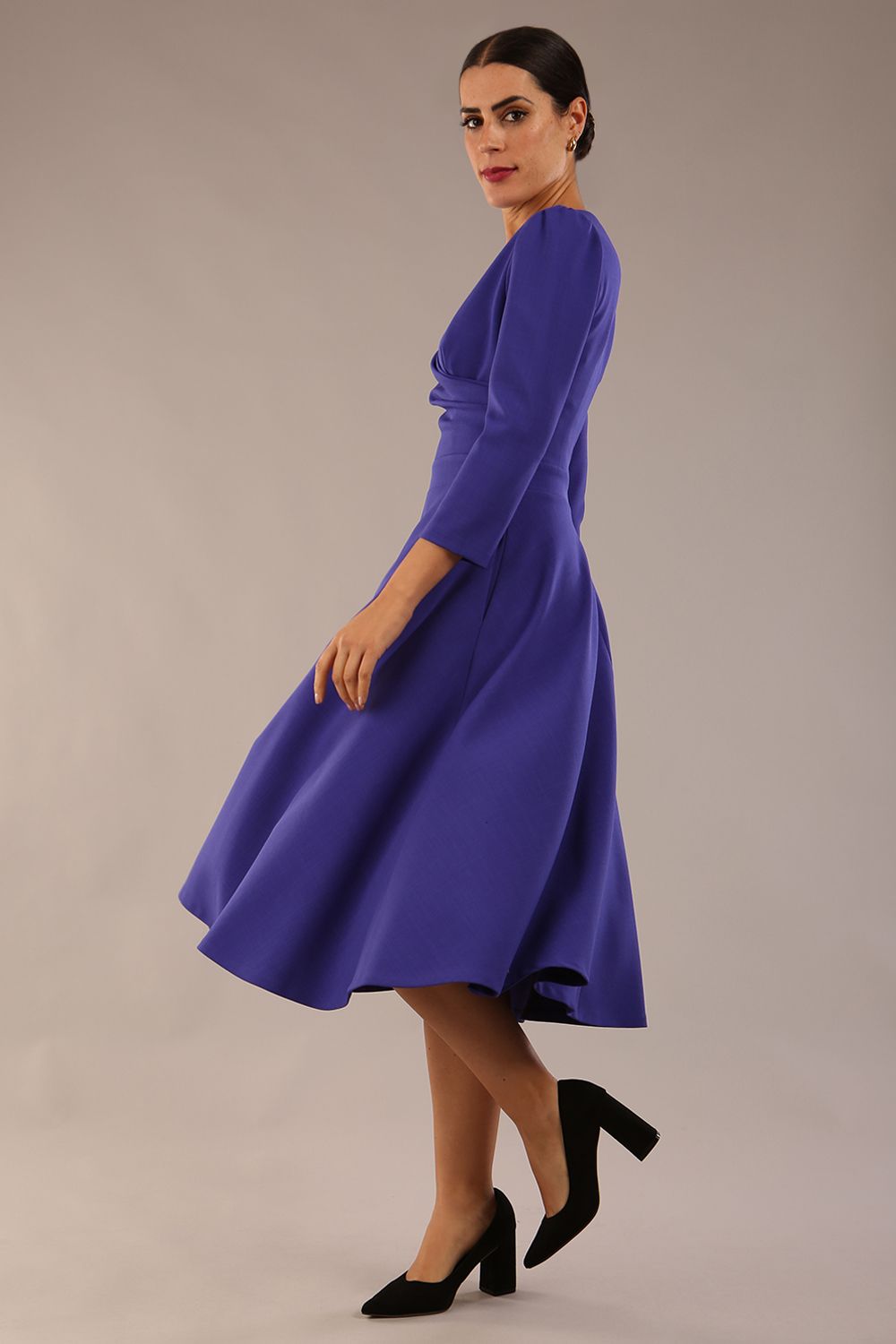 Model wearing diva catwalk Kate 3/4 Length Sleeve A-Line Swing Dress in Spectrum Indigo with pockets  side