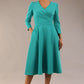 Model wearing diva catwalk Kate 3/4 Length Sleeve A-Line Swing Dress with side pockets in Aqua Green colour