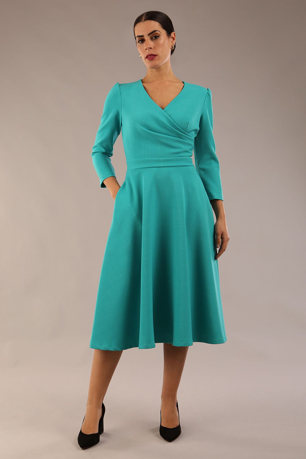 Model wearing diva catwalk Kate 3/4 Length Sleeve A-Line Swing Dress with side pockets in Aqua Green colour