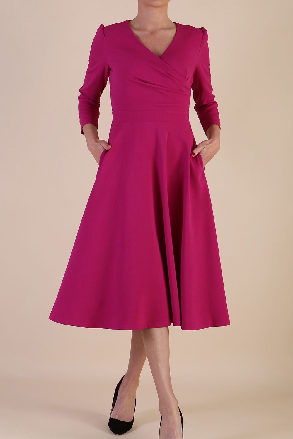 Model wearing diva catwalk Kate 3/4 Length Sleeve A-Line Swing Dress in Magenta Haze with pockets front
