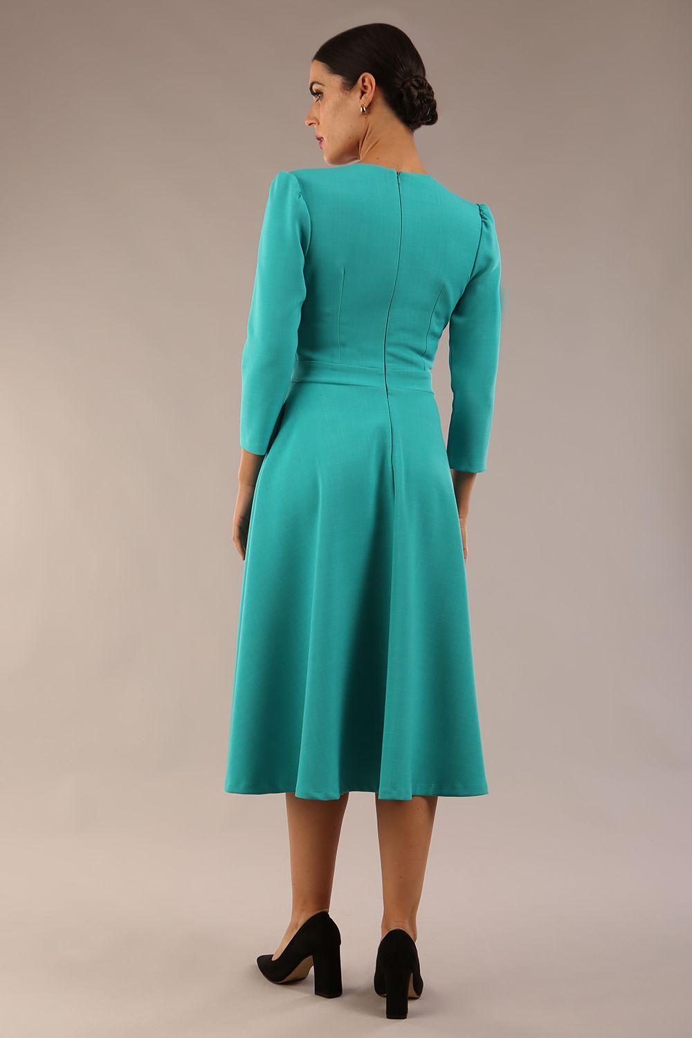 Model wearing diva catwalk Kate 3/4 Length Sleeve A-Line Swing Dress with side pockets in Aqua Green colour