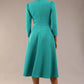 Model wearing diva catwalk Kate 3/4 Length Sleeve A-Line Swing Dress with side pockets in Aqua Green colour back