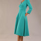 Model wearing diva catwalk Kate 3/4 Length Sleeve A-Line Swing Dress with side pockets in Aqua Green colour