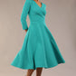 Model wearing diva catwalk Kate 3/4 Length Sleeve A-Line Swing Dress with side pockets in Aqua Green colour