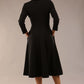 Model wearing diva catwalk Kate 3/4 Length Sleeve A-Line Swing Dress with pockets in Black back