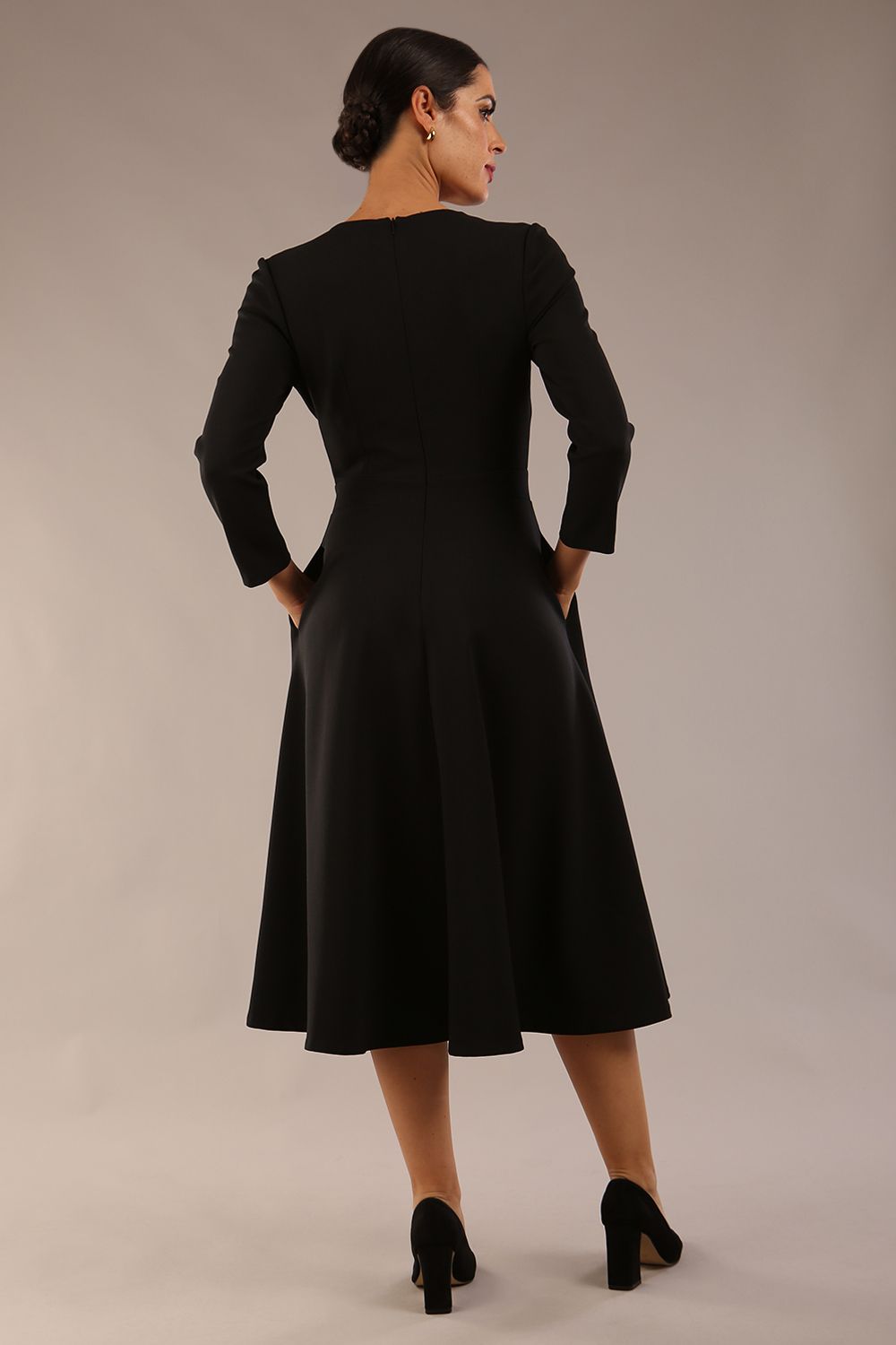 Model wearing diva catwalk Kate 3/4 Length Sleeve A-Line Swing Dress with pockets in Black back