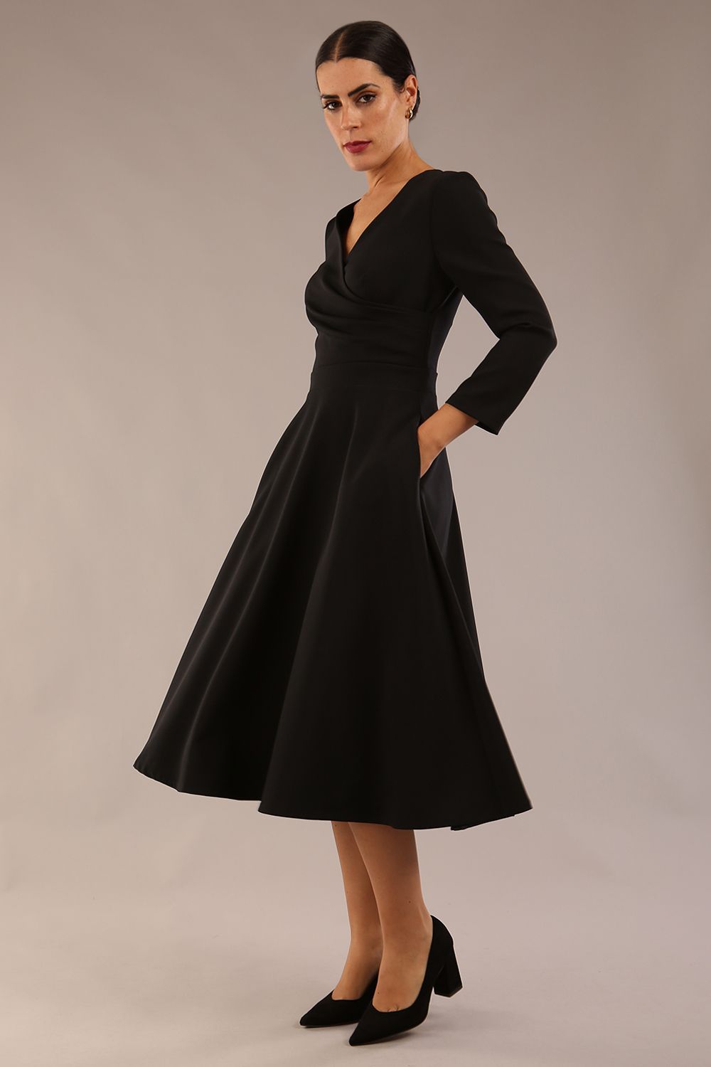 Model wearing diva catwalk Kate 3/4 Length Sleeve A-Line Swing Dress with pockets in Black front