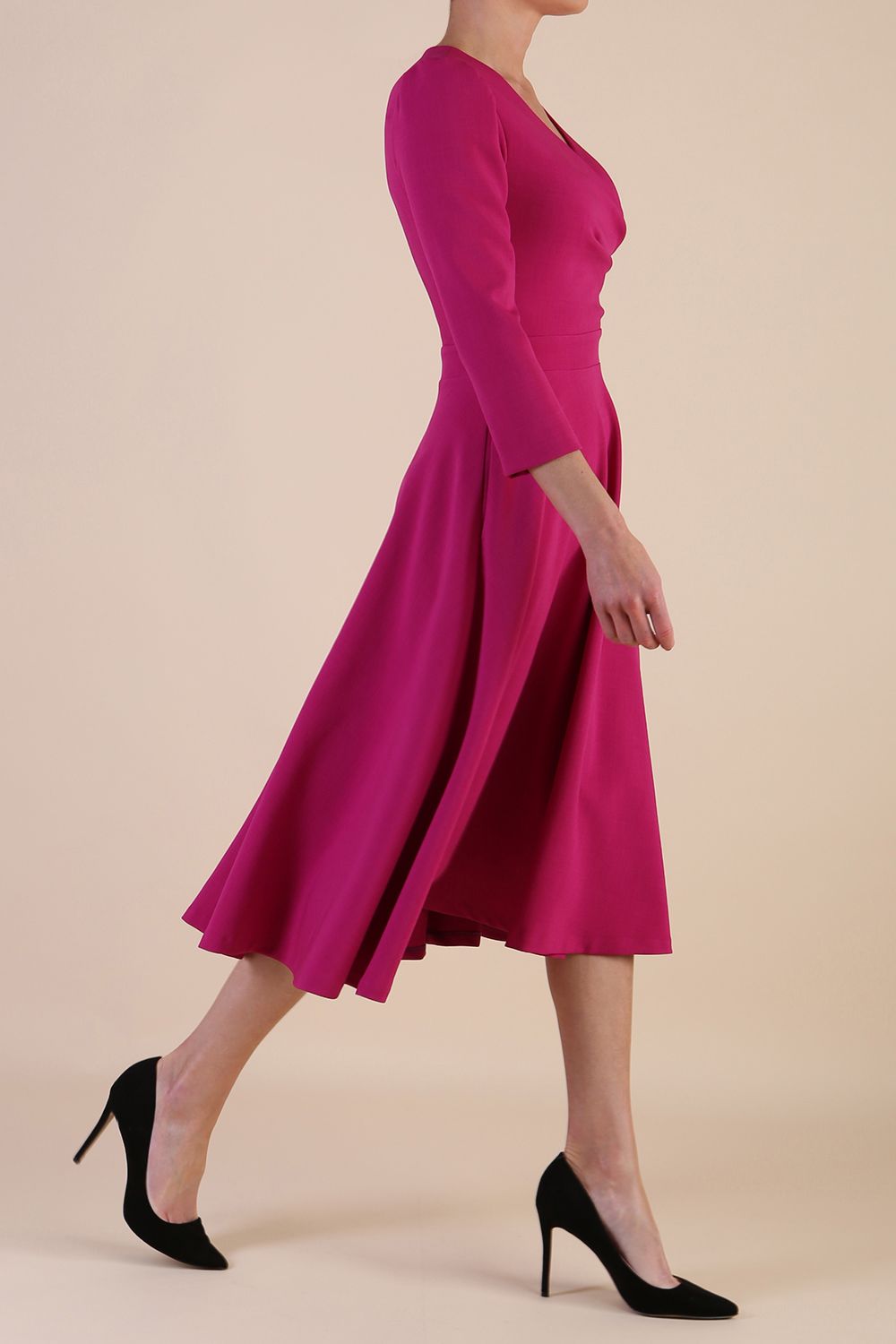 Model wearing diva catwalk Kate 3/4 Length Sleeve A-Line Swing Dress in Magenta Haze with pockets side